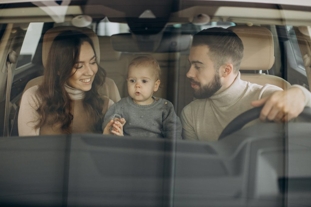 family-with-bbay-girl-choosing-car-car