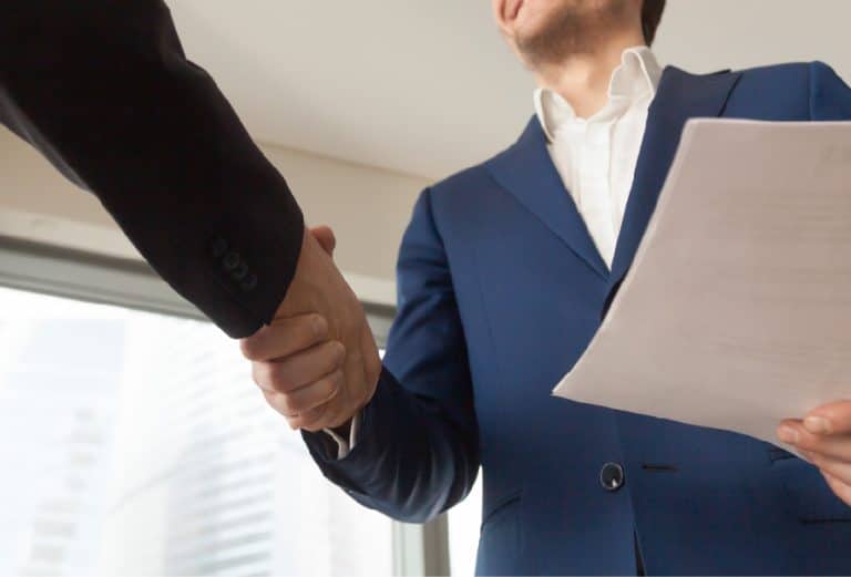 smiling-company-manager-welcoming-client-office-01