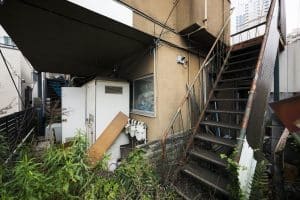 old-abandoned-house-with-rusty-stairs-railings