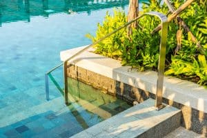 outdoor-swimming-pool-with-stair-ladder-around-there-