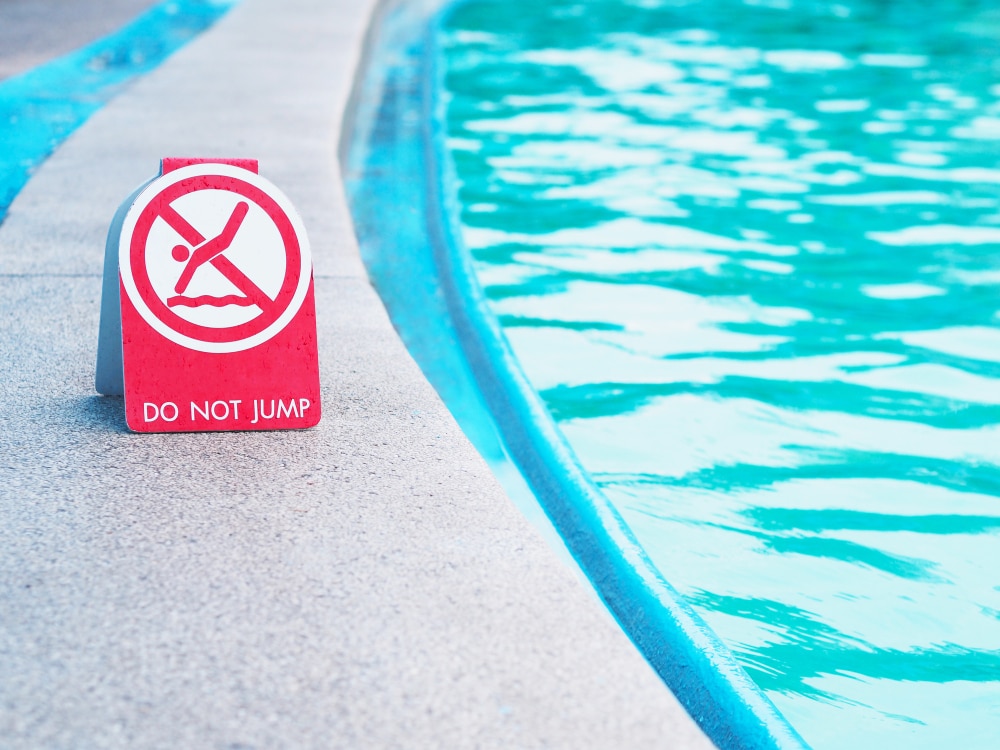 pool with sign that reads 'do not swim'.