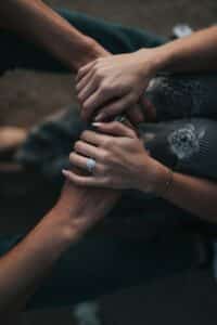Woman holding a man's hands