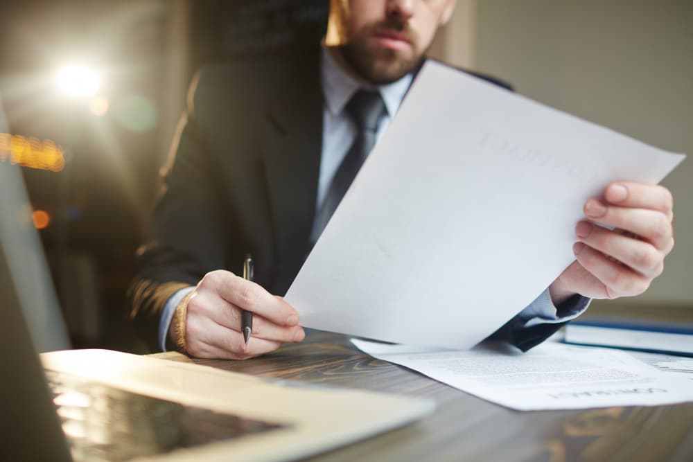 a man closely examining a document
