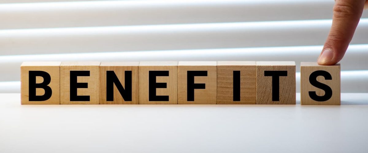 BENEFITS word written on wood block BENEFITS text on wooden blocks on table