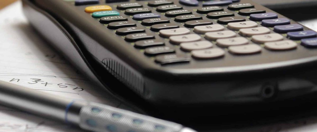 Image of a black calculator and grey pen