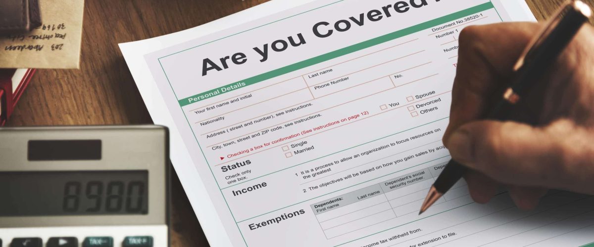 Image: signing an insurance document