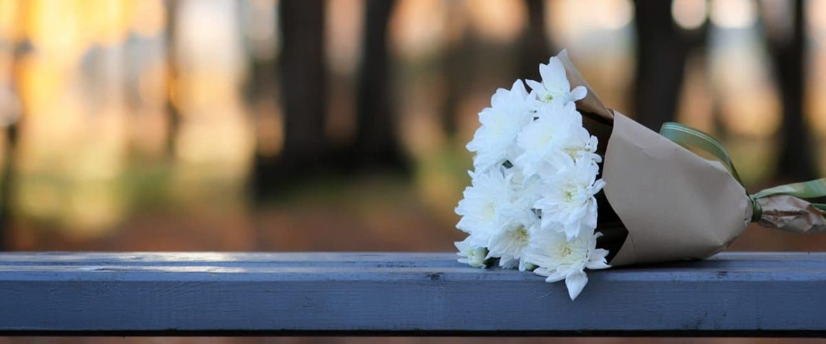 Autumn bench park lost bouquet of flowers