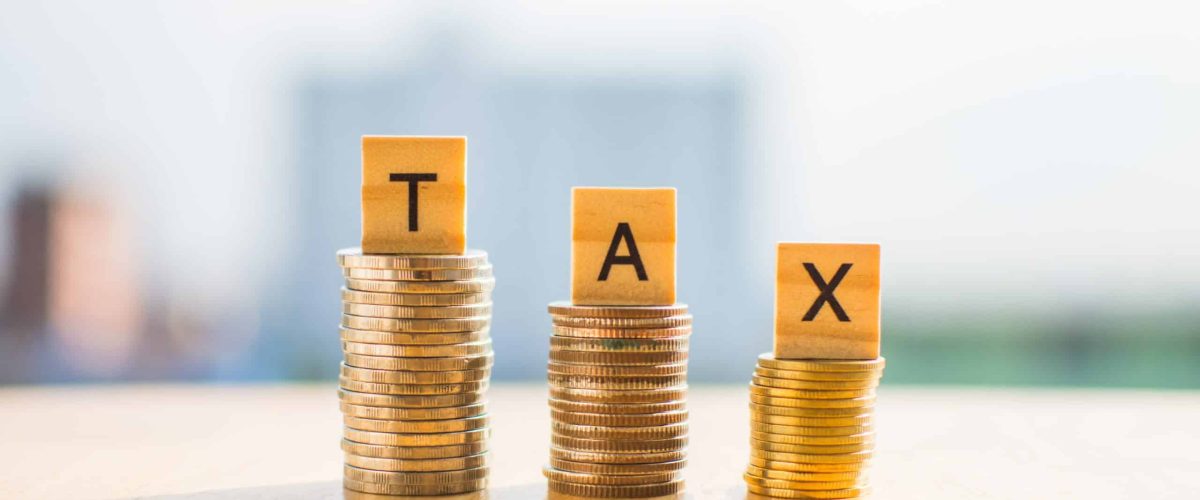 Banner Image_coin-money-wooden-table-text-tax-save-with-blur-background-min-scaled