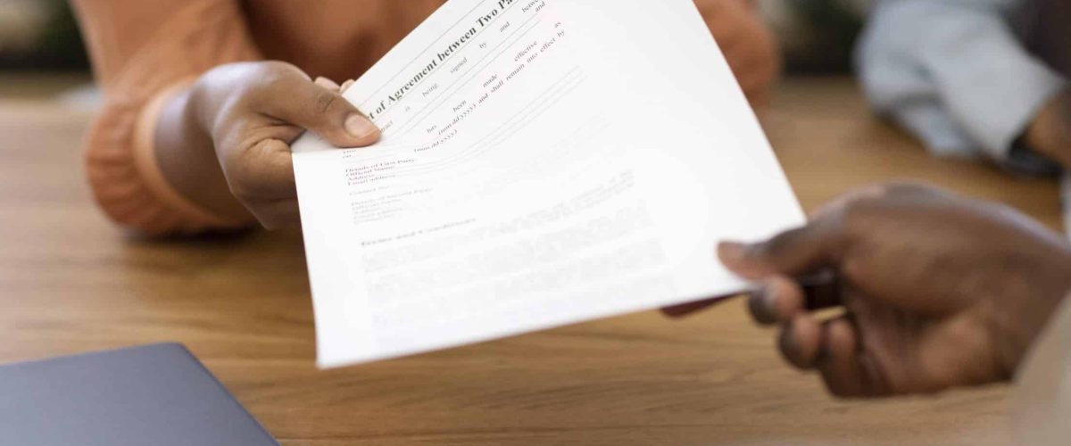 man holding contract