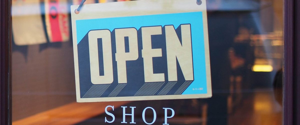 Entrance of a shop with an open sign